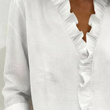 CLARA - Blusa con escote en V y delicados volantes