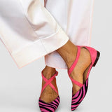 Zarella - Flache Sandalen mit Zebra-Muster und gekreuzten Riemen am Knöchel