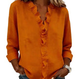 CLARA - Blusa con escote en V y delicados volantes